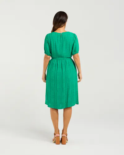 Model wearing Green Joana Dress By Seduce Available at Beetees Nelson